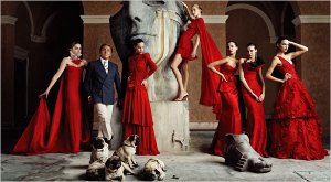 Valentino with his models, his designs and his infamous pugs at his Atelier in Rome
